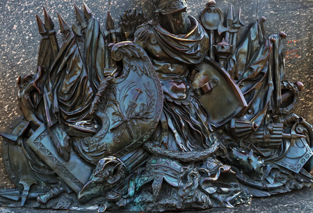 Monument of Glory fragment military bas-relief war soldier battle warrior bronze background. Poltava. Ukraine.の写真素材