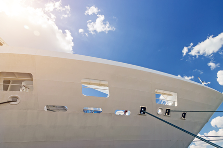 Thick rope white cruise ship near the pier. Summer vacation Cruise travel tourism concept. Ship cruise liner deck blue waves sea view romantic landscape.の写真素材