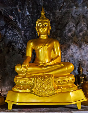 Golden Buddha statue sitting lotus in buddhist temple. Buddhist holiday - Happy Bodhi day achieved enlightenment.のeditorial素材