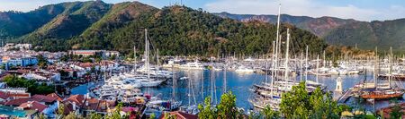 Panorama sea view sailboats Turkey mountain City port Marmaris holiday vacation background concept. Marmaris old town Lighthouse sea view Turkey mountain.の写真素材