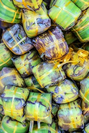 Healthy eating snack in palm green leaf diet concept vegetables backgroundの写真素材