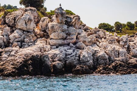 Panoramic rock island view on amazing bay. Ionian Sea blue water in Greece.の写真素材