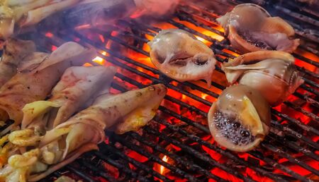 scallop seashell muscle mussel oyster flaming charcoal grill with open fire grilling barbecue steamed Cooking bbq Food Backgroundの写真素材