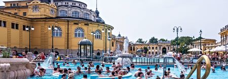 BUDAPEST, HUNGARY - August 24, 2019: Szechenyi Baths and and people public pools outdoor, Budapest. Largest thermal bath complex in Hungary and in Europe as well.のeditorial素材