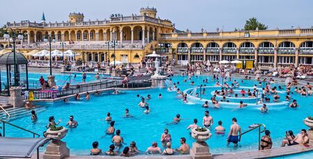 Szechenyi Thermal spa outdoor bath people public In Budapest. Szechenyi Medicinal Bath is the largest medicinal house with so many pools in Europe, Hungary. August 24, 2019のeditorial素材