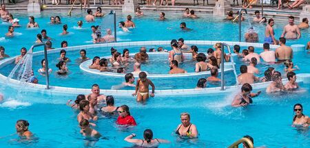 BUDAPEST, HUNGARY - August 24, 2019: Experience Szechenyi Baths and outdoor Pool Baroque-style...