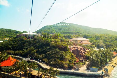NHA TRANG, VIETNAM - FEB 12, 2015: Cable car tower to Vinpearl Amusement Park Island cableway long rope road on water bay Nha Trang, Vietnamのeditorial素材
