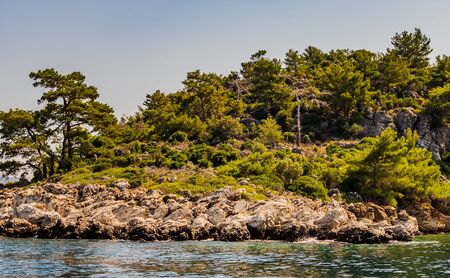 Beautiful Bay mountain valleys above wide open sea tropical island with white sand beach and blue clear water granite stones. Sea in Turkey. Turkish coast.の写真素材