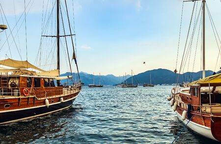 wooden sailboat cruise ship near the pier seaport in the bay blue lagoon Aegean Sea in Turkey. Turkish coast.の写真素材