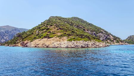 Beautiful Bay mountain valleys above wide open sea tropical island with white sand beach and blue clear water granite stones.の写真素材