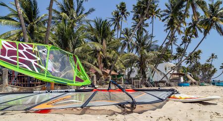 Mui Ne, Phan Thiet, Vietnam - Feb 16, 2015: Windsurfing boards storage. Mui Ne Coco Beach sand, palm trees. Tourists vacation Cam Ranh Bay in Vietnam.のeditorial素材