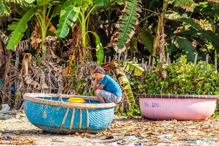 PHAN THIET, MUI NE, VIETNAM - Feb 16, 2015: Fisherman catch boats Vietnamese. People working at fishing pier in fishing village Phan Thiet, Travel Southeast Asia Coast Binh Thuan of Vietnam.のeditorial素材