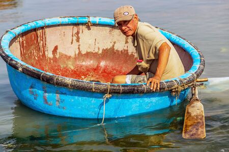 PHAN THIET, MUI NE, VIETNAM - Feb 16, 2015: Fisherman catch boats Vietnamese. People working at fishing pier in fishing village Phan Thiet, Travel Southeast Asia Coast Binh Thuan of Vietnam.のeditorial素材