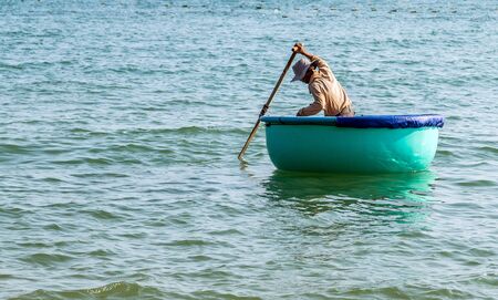 PHAN THIET, MUI NE, VIETNAM - Feb 16, 2015: Fisherman catch boats Vietnamese. People working at fishing pier in fishing village Phan Thiet, Travel Southeast Asia Coast Binh Thuan of Vietnam.のeditorial素材