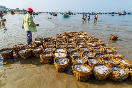 PHAN THIET, VIETNAM - Feb 16, 2015: People fisherman catch working at Vietnamese PHAN THIET harbour fishing village Vietnam. Travel Southeast Asia Coast Binh Thuan of Vietnam.のeditorial素材