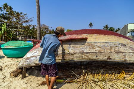 PHAN THIET, MUI NE, VIETNAM - Feb 16, 2015: Fishing Vietnamese boats at the sand beach Mui Ne in fishing village Phan Thiet, Travel Southeast Asia Coast Binh Thuan of Vietnam.のeditorial素材