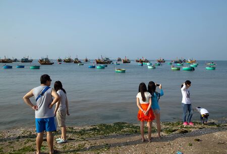 PHAN THIET, VIETNAM - Feb 16, 2015: People fisherman catch working at Vietnamese PHAN THIET harbour fishing village Vietnam. Travel Southeast Asia Coast Binh Thuan of Vietnam.のeditorial素材
