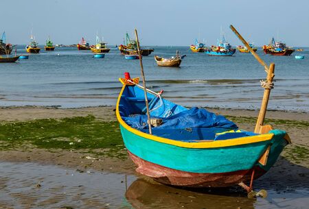 PHAN THIET, MUI NE, VIETNAM - Feb 16, 2015: Fishing Vietnamese boats at the sand beach Mui Ne in fishing village Phan Thiet, Travel Southeast Asia Coast Binh Thuan of Vietnam.のeditorial素材