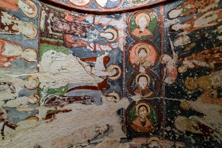 Goreme, Cappadocia, Turkey - May 07, 2014: Fresco Christian Decoration on Ceiling background in cave orthodox El Nazar Old Church at the Goreme open air museum Cappadocia, Anatolia Turkeyのeditorial素材