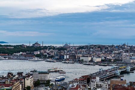 Istanbul, Turkey - May 01, 2014: Panorama sunset aerial cityscape Istanbul architecture. Galata Bridge in Golden Horn Sea. Historic center of City Istanbul Turkey.のeditorial素材