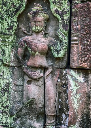 stone bas-relief Khmer ancient temple in complex Angkor Wat in Siem Reap, Cambodiaの写真素材