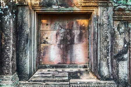 detail of ancient stone bas-relief carvings on the wall background texture - complex Angkor wat Cambodia.の写真素材