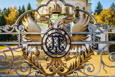 Gold Russian two-headed eagle of back side , background Sampsoniy Church on the battlefield Battle of Poltava, Ukraineのeditorial素材