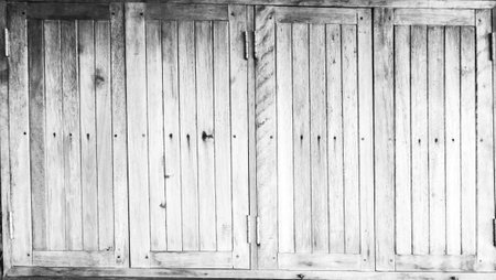 White painted wooden door padlock on a light background washed woodの写真素材