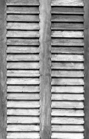 White painted wooden door on a light background washed woodの写真素材