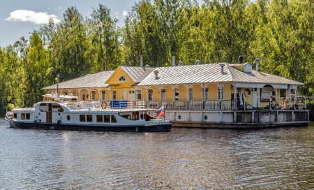 Verkhniye Mandrogi, RUSSIA - JUNE 15, 2015: River pier wooden motor ship Swallow (Lastochka). Cruise Svir river Mandrogi crafts old Russian villageのeditorial素材