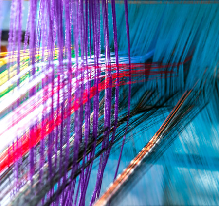 Colored threads cotton weaving on manual wooden loom. National Handloom Day.の写真素材