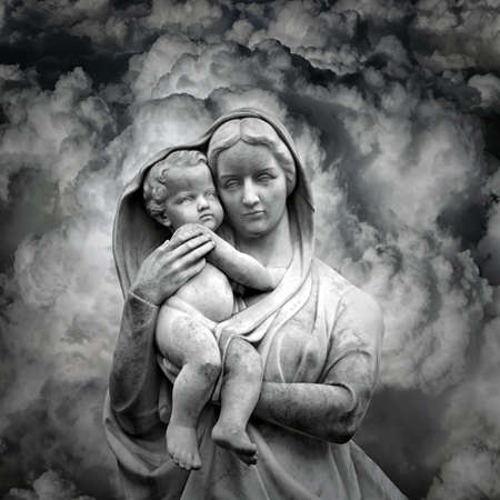 Vigin Mary mother statue carrying the saint baby Jesus in Cloudsの写真素材
