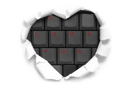 Art banner design in shape of heart in white paper with words I Love You on keyboard