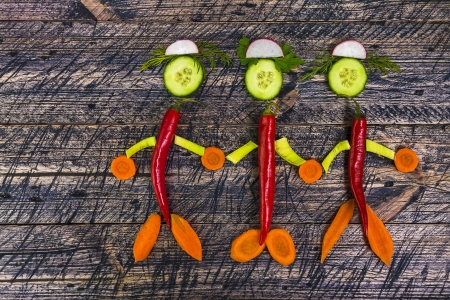 Composition with early vegetables on wooden boardの写真素材