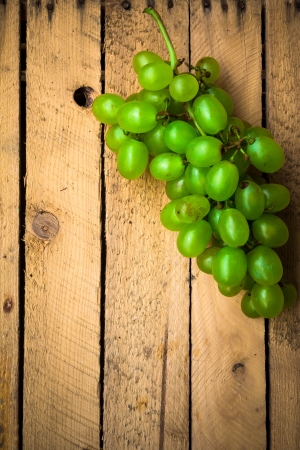 Autumn harvest of fruits on wooden backgroundの写真素材