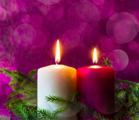 Christmas ornaments. Lighted candles and spruce twigsの写真素材