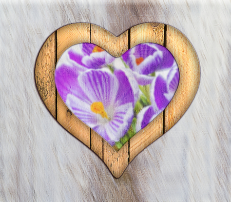 Wooden border of hearts shape on the wooden wall with view from flowersの写真素材
