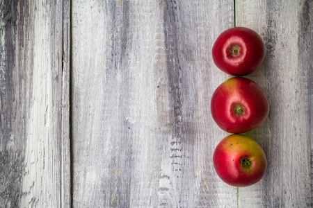 Autumn harvest of fruits on wooden backgroundの写真素材