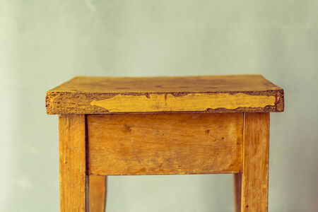 Old wooden table on a dirty background