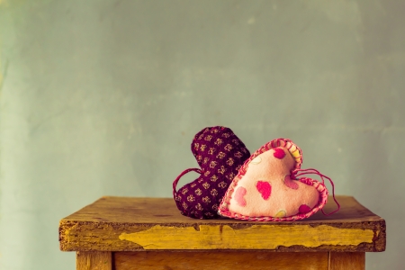 Two hearts on a wooden tableの写真素材