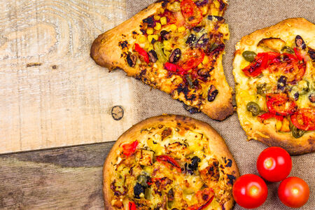 Closeup of a heavily toasted slices of pizza
