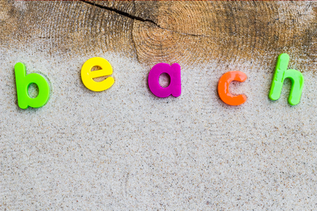 The word beach laid on the sandの写真素材