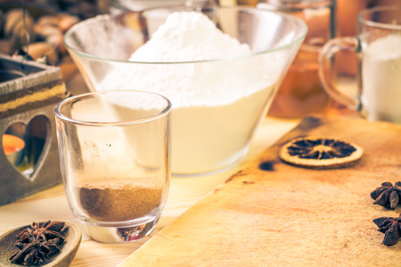 The ingredients for the preparation of christmas iced gingerbread on the kitchen table
