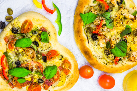 Closeup of pizza with cheese, meat and vegetablesの写真素材