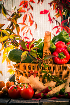 A basket full of fresh vegetables in a rural settingの写真素材