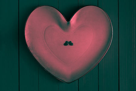 Many colorful little hearts on the wooden backgroundの写真素材