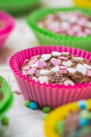 Cookies for lovers: colorful muffins with heartsの写真素材
