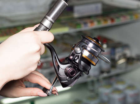 rod and reel for fishing in female hands