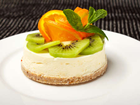 sweet cake with fruits isolated on whiteの写真素材