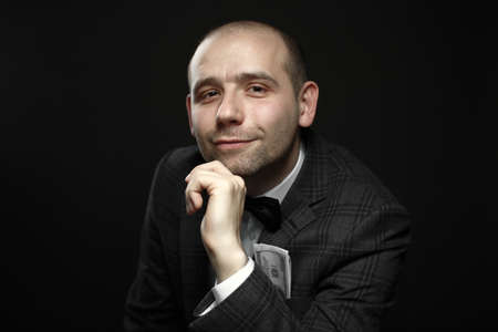 Elegant young man in suit and tie, businessman with money in his pocket 